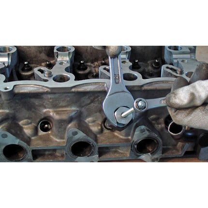 action shot of glowplug removal tool in use using spanners.